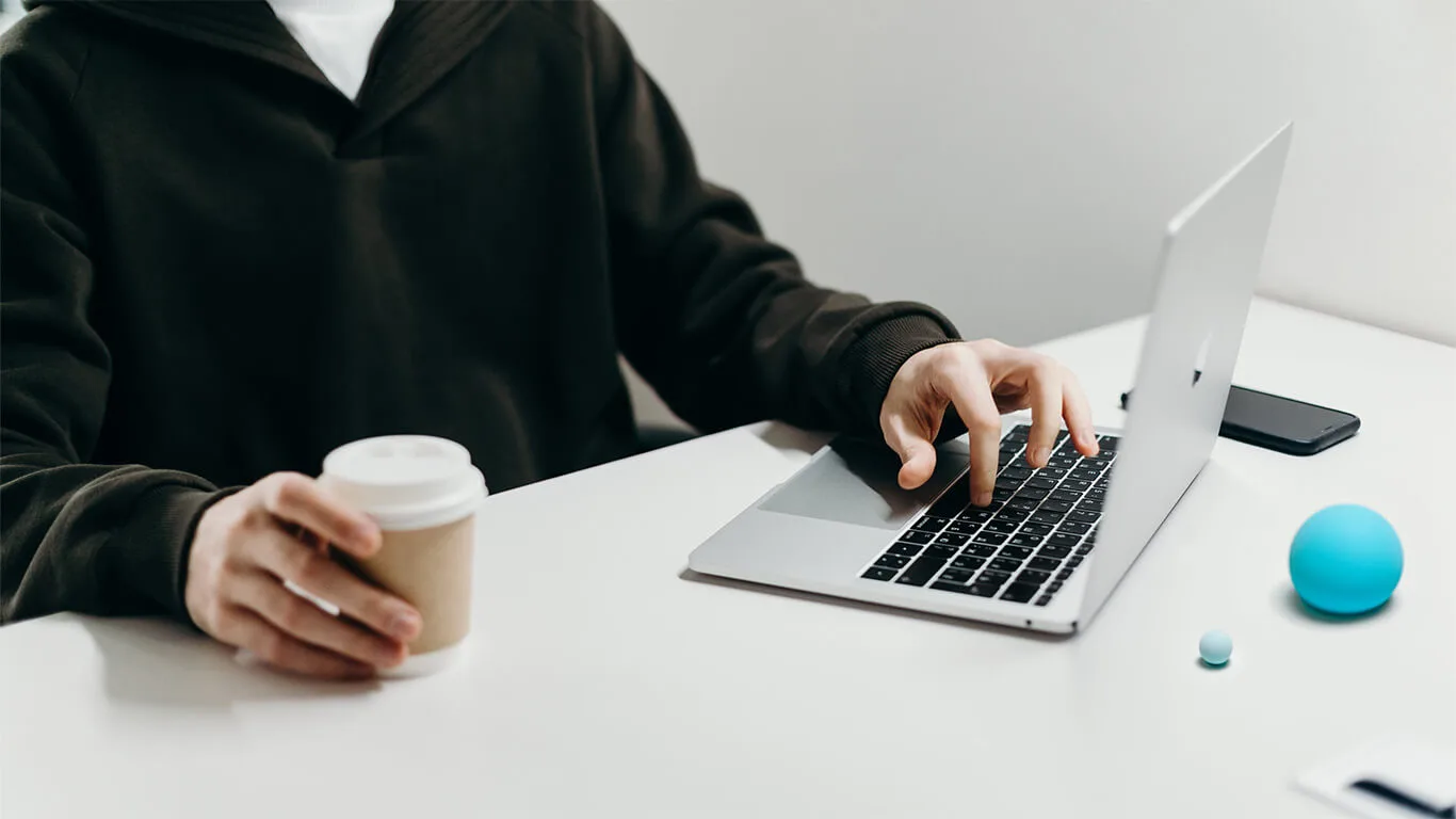 image shows man using structured authoring on computer