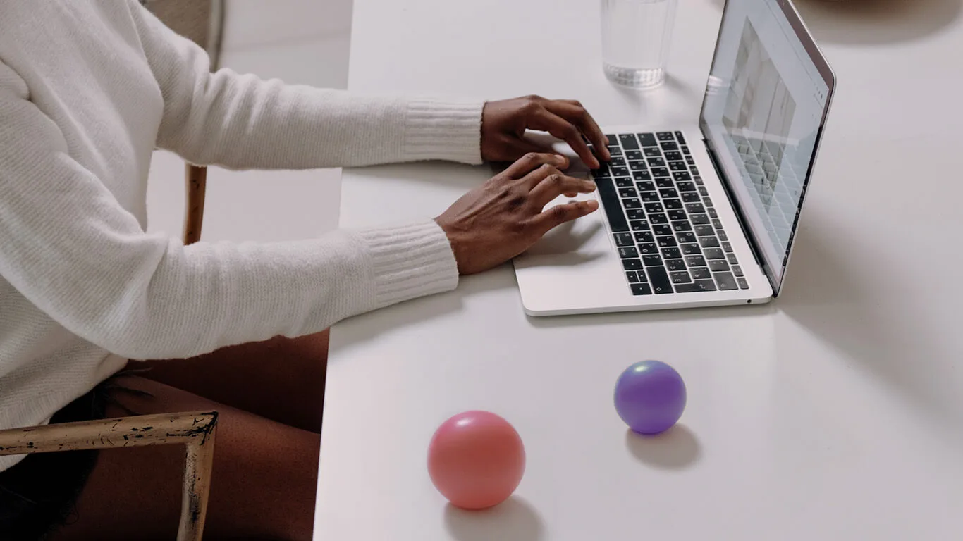 image shows woman typing with a structured authoring system