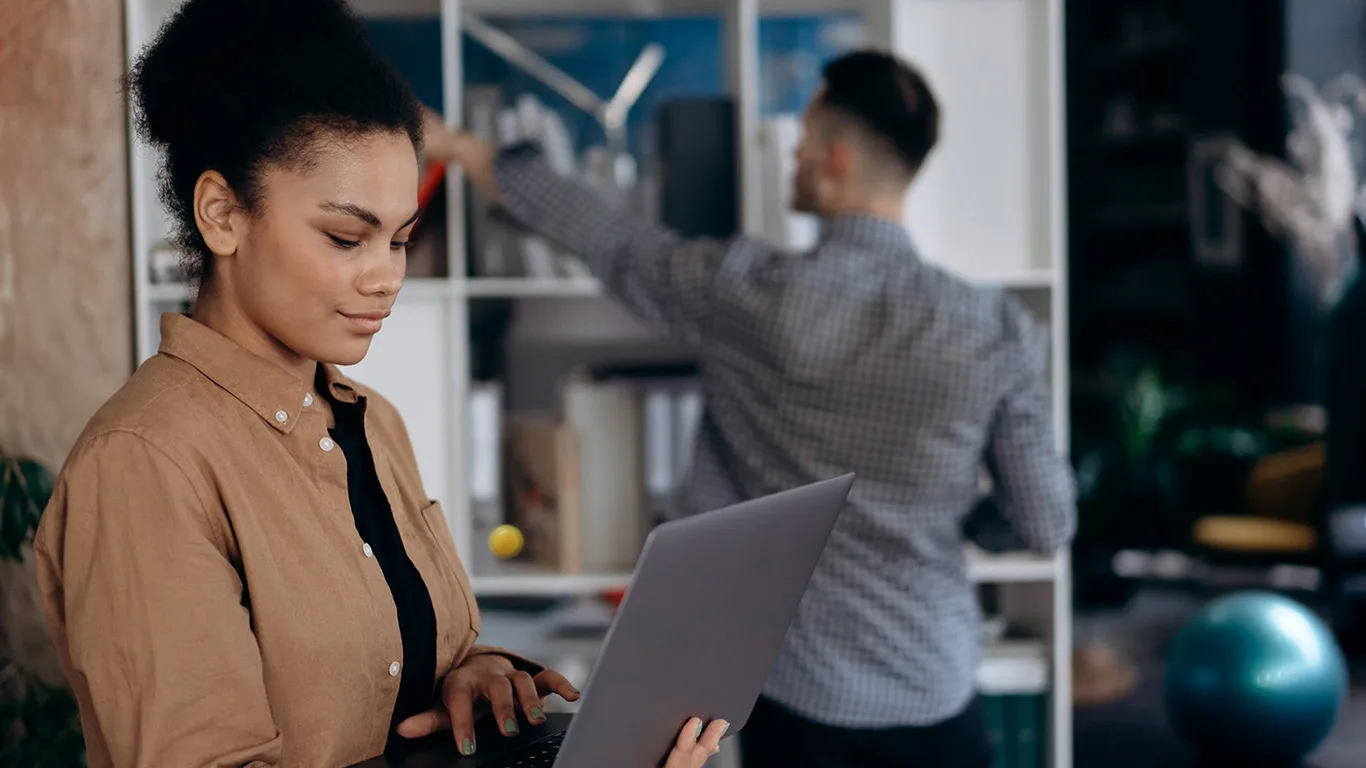 image shows woman working with documentation at a scaleup