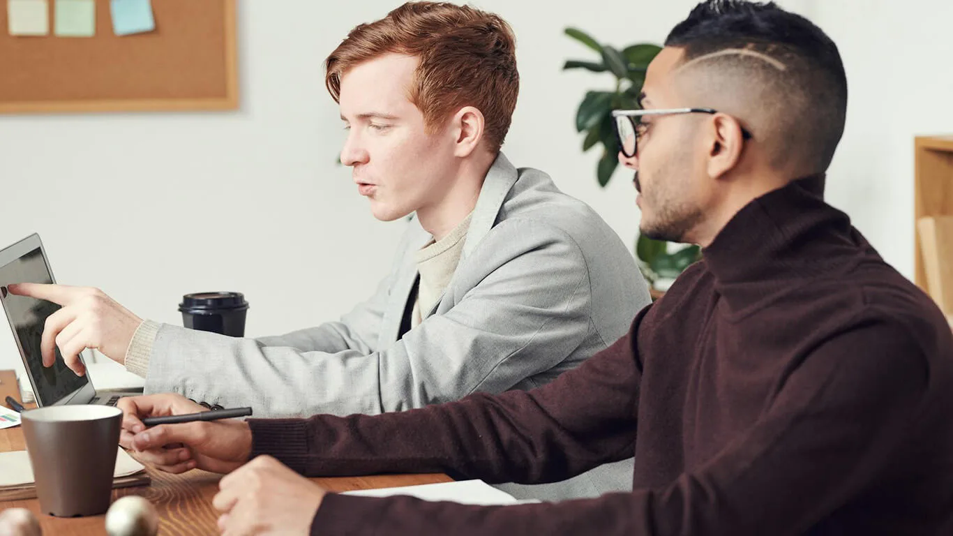 image shows two people working in documentation software