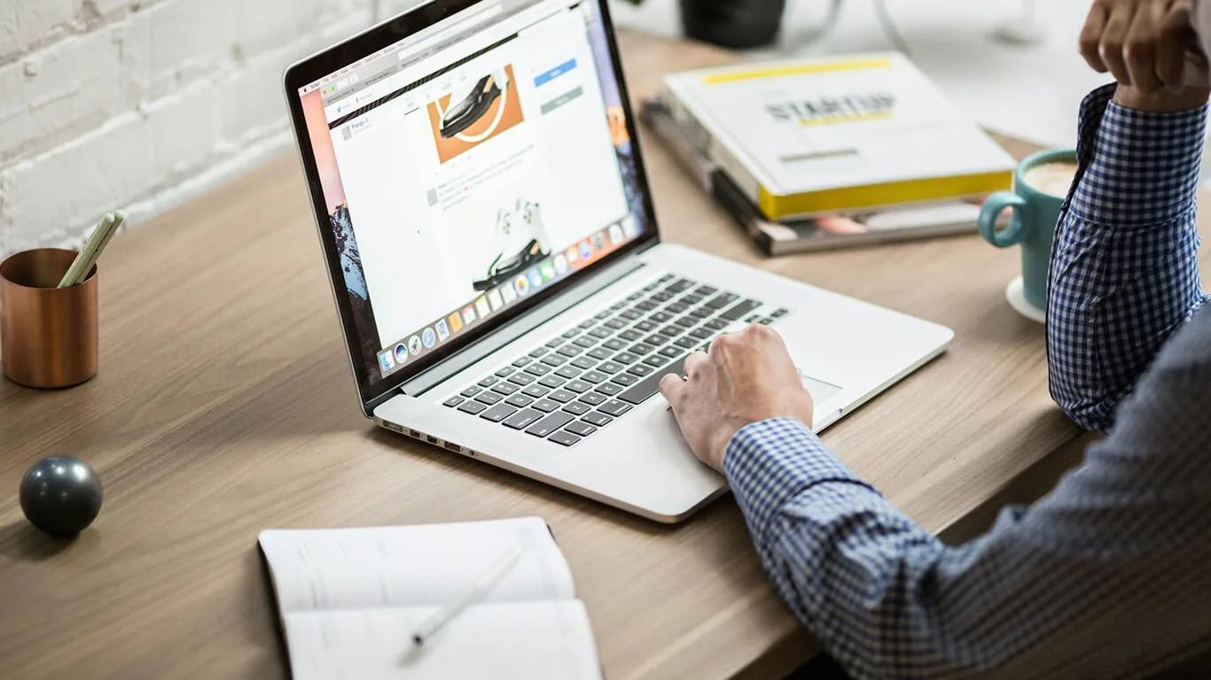 image shows man using tech writing software