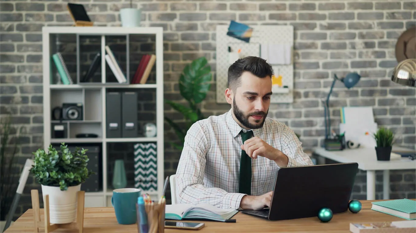 image shows man using ccms for his documentation management