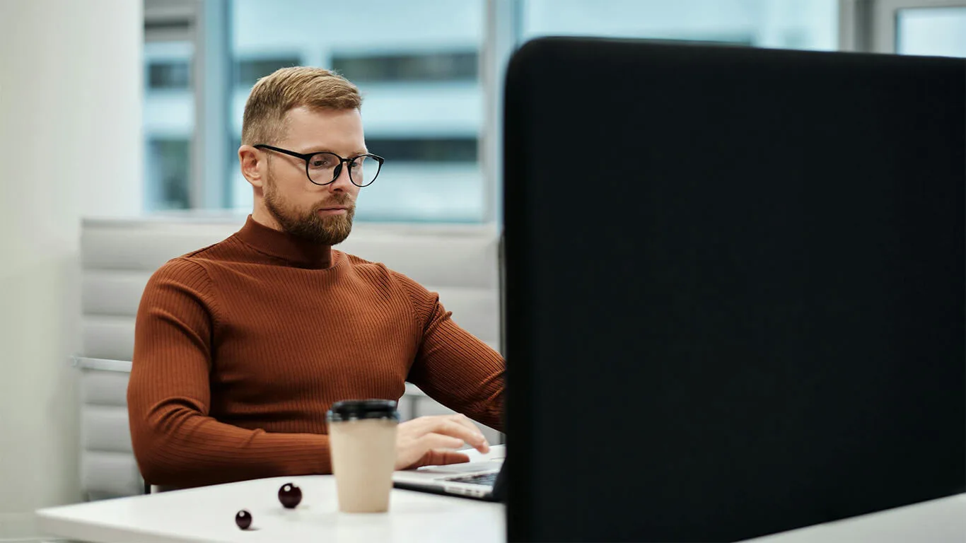 image shows a man using a ccms for his technical pubilcations