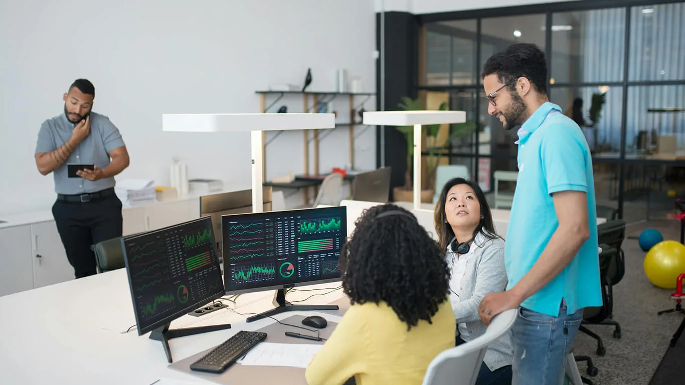 image shows people working on help center documentation in an office
