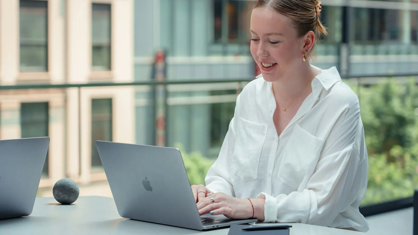 image shows woman writing technical documentation