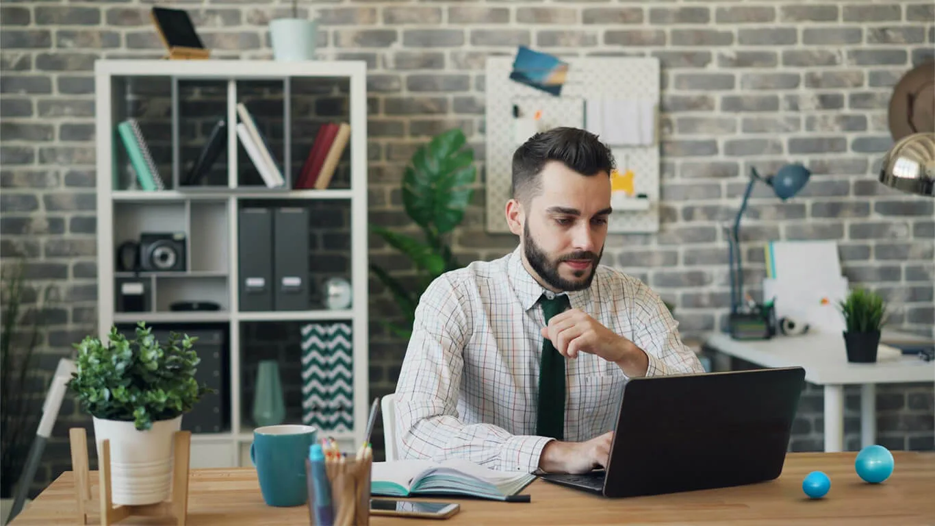 image shows man using a ccms for technical communication