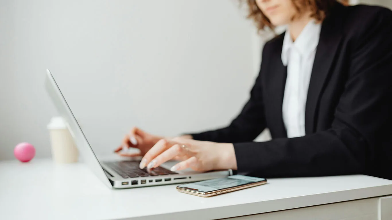 image shows woman using CCMS software on her computer