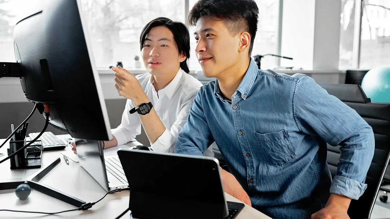 image shows software employees creating with a CCMS