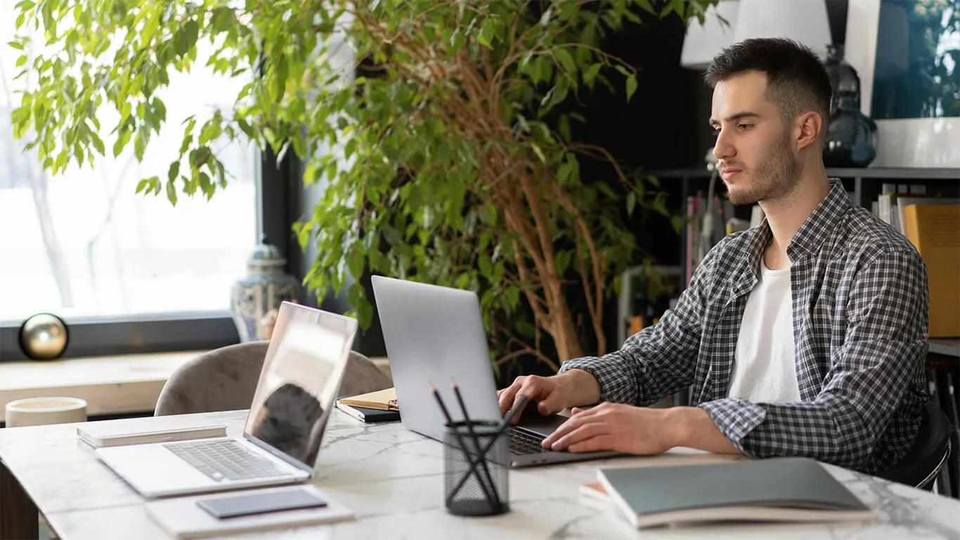 image shows man structuring content in a CCMS on his computer