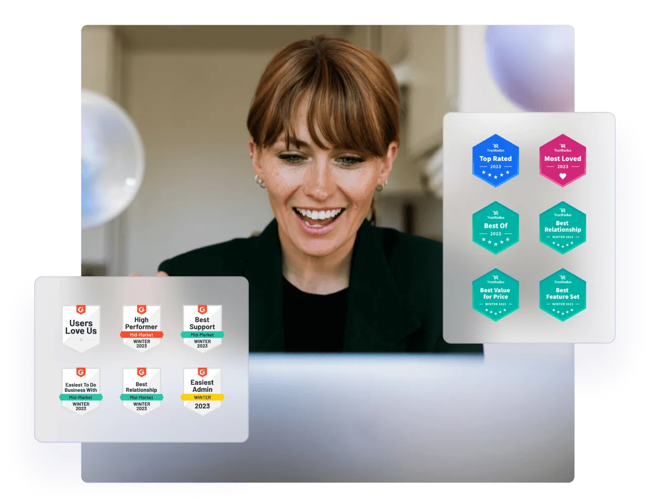 Smiling woman at a computer, with G2 award badges for Paligo